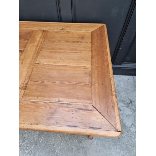 1008 - An old Continental pine drawleaf table, 109cm wide when closed.