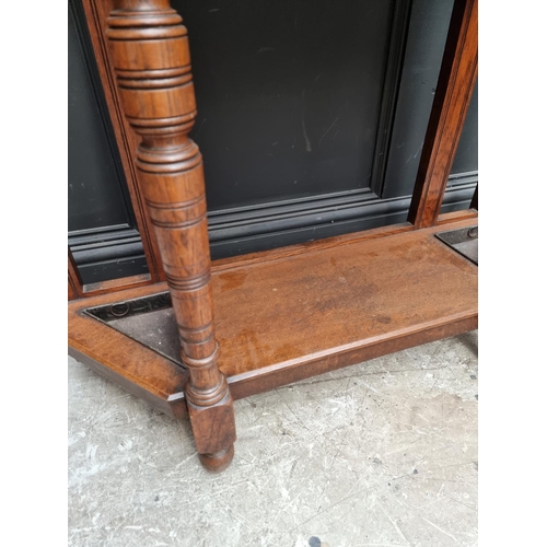 1019 - A circa 1900 carved oak hall stand, 107cm wide.