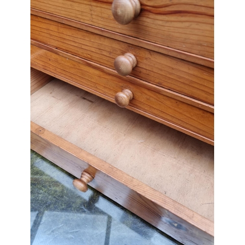 1022 - A miniature pine chest of drawers, 53cm wide. 