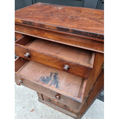 1036 - A Victorian figured walnut Wellington chest, 57cm wide.  