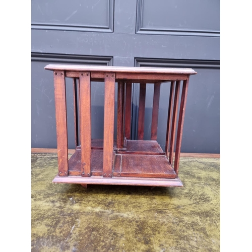 1042 - A small antique mahogany table top revolving bookcase, 34.5cm wide.