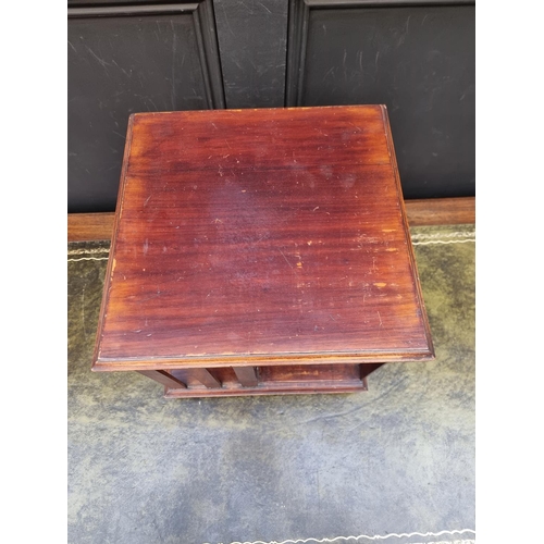 1042 - A small antique mahogany table top revolving bookcase, 34.5cm wide.
