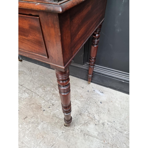 1051 - An early Victorian mahogany washstand, 101.5cm wide.