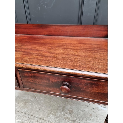 1051 - An early Victorian mahogany washstand, 101.5cm wide.