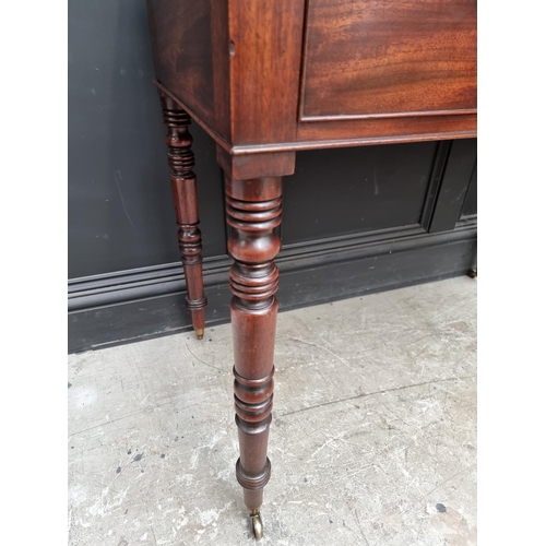 1051 - An early Victorian mahogany washstand, 101.5cm wide.