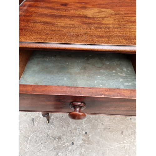 1051 - An early Victorian mahogany washstand, 101.5cm wide.