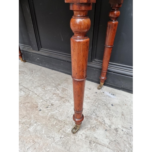 1052 - A Victorian mahogany washstand, 106cm wide.