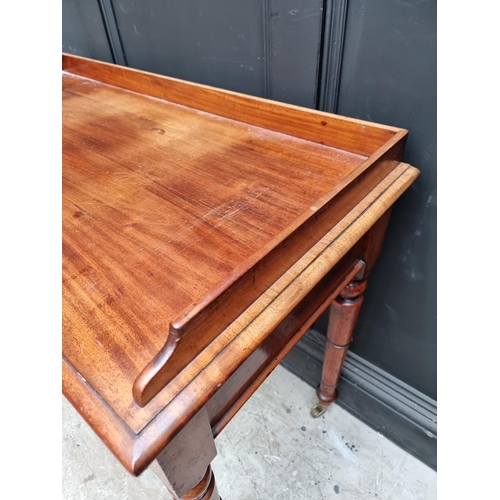 1052 - A Victorian mahogany washstand, 106cm wide.