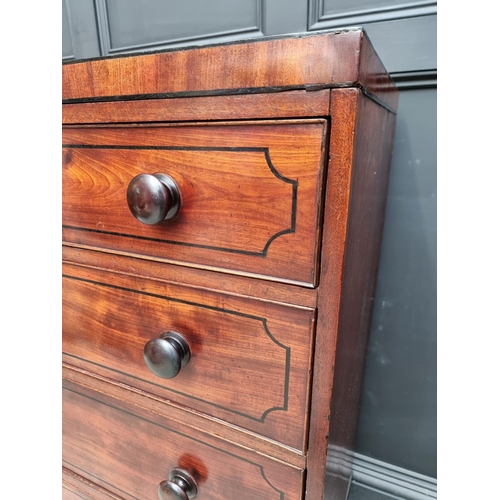 1068 - An early 19th century mahogany and ebony strung chest of drawers, 102cm wide.