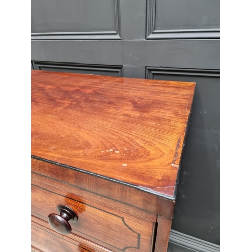 1068 - An early 19th century mahogany and ebony strung chest of drawers, 102cm wide.