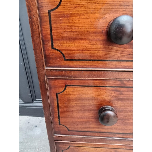 1068 - An early 19th century mahogany and ebony strung chest of drawers, 102cm wide.