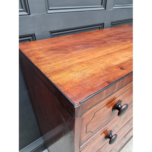 1068 - An early 19th century mahogany and ebony strung chest of drawers, 102cm wide.