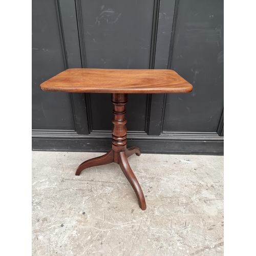 1075 - A Victorian mahogany rectangular tilt-top tripod table, 68cm wide.