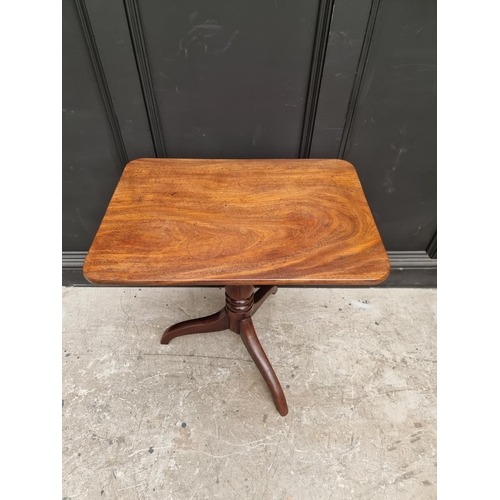 1075 - A Victorian mahogany rectangular tilt-top tripod table, 68cm wide.