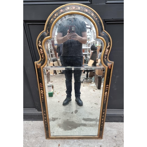 1074 - An 18th century style ebonized and parcel gilt framed wall mirror, 132cm high x 65cm wide. ... 