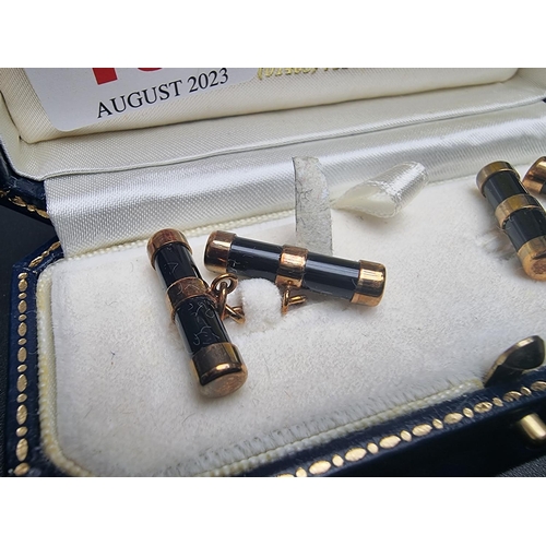 464 - A cased pair of 9ct gold and onyx cylinder cufflinks, by W H M, Birmingham 1999, 21mm long.... 