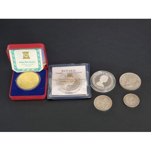 105 - Coins: five various silver coins; to include a Tuvalu 1993 $20 coin and a South Africa 1951 five shi... 