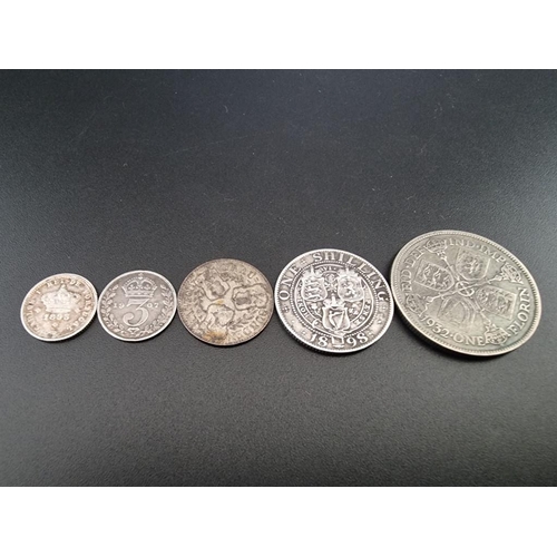 125 - Coins: five various silver coins, to include a 1932 florin.