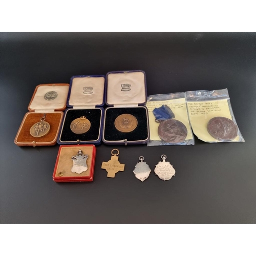 139 - Medals: two 1893 British Dairy Farmers Association bronze medals; together with three British army s... 