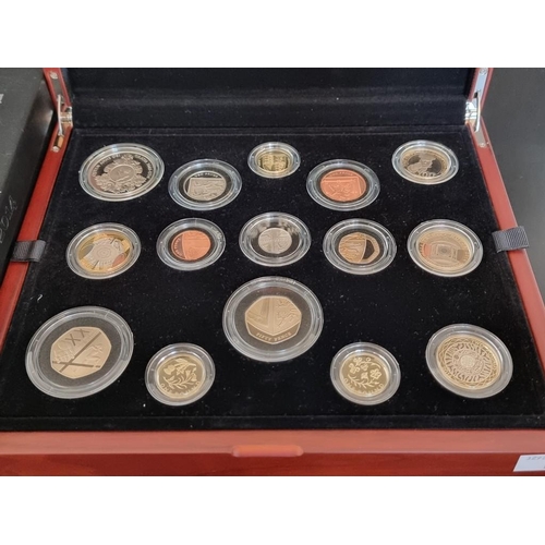 15 - Coins: a 2014 Royal Mint 'UK Premium Proof Set', containing fourteen coins, with CoA No.1650/4500, b... 