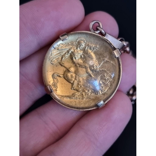 2 - Coins: a Victoria 1893 gold double sovereign, in a pendant mount, stamped 15ct, on a yellow metal ch... 