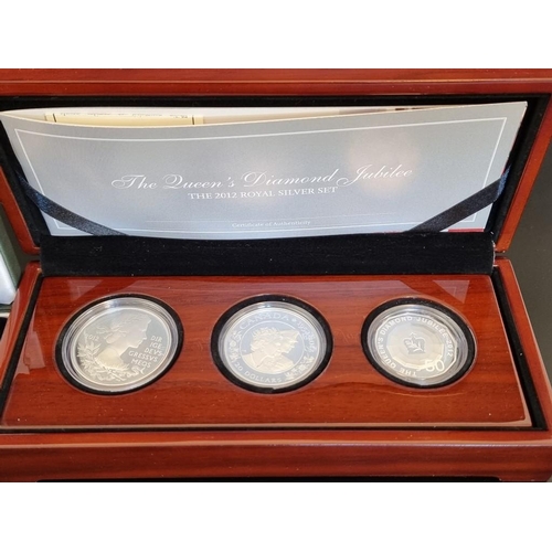 39 - Coins: a 2012 'The Royal Silver Set', containing three silver proof coins from The Royal Mint, The R... 