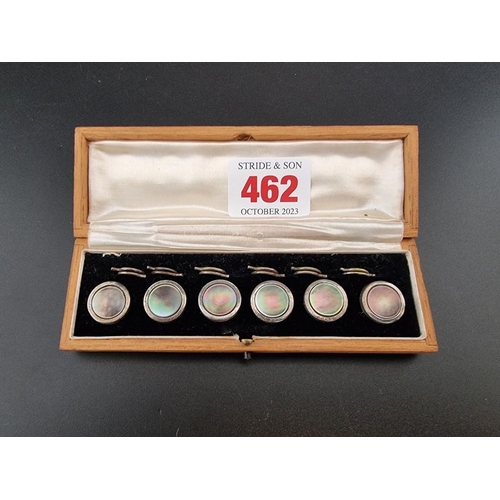 462 - An oak cased set of six silver and mother of pearl buttons, by J Aitkin & Son, 14mm diameter.... 