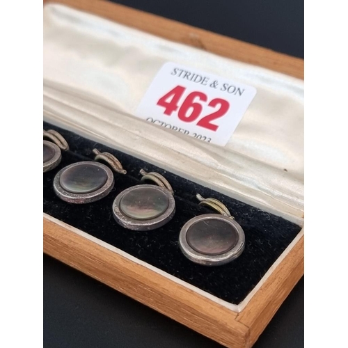 462 - An oak cased set of six silver and mother of pearl buttons, by J Aitkin & Son, 14mm diameter.... 