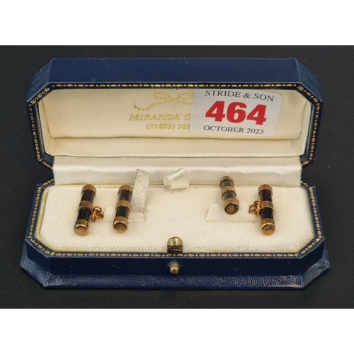 464 - A cased pair of 9ct gold and onyx cylinder cufflinks, by W H M, Birmingham 1999, 21mm long.... 