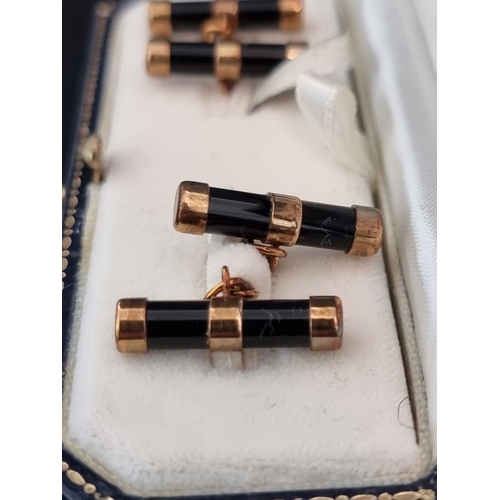 464 - A cased pair of 9ct gold and onyx cylinder cufflinks, by W H M, Birmingham 1999, 21mm long.... 