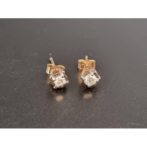 470 - A pair of yellow metal diamond ear studs, of approximately 0.10ct, stamped 10k.