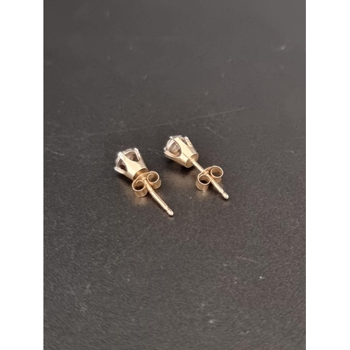 470 - A pair of yellow metal diamond ear studs, of approximately 0.10ct, stamped 10k.