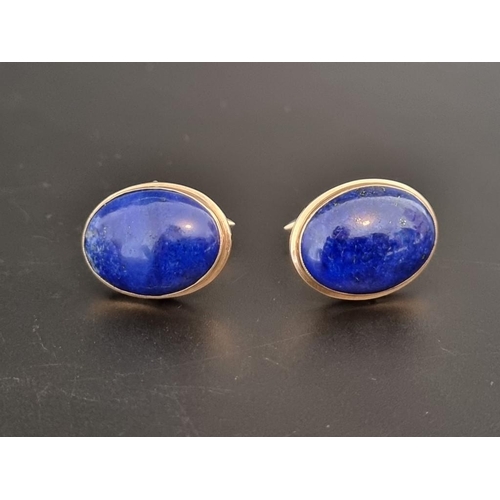 472 - A pair of yellow metal and lapis lazuli cufflinks, stamped 14k.