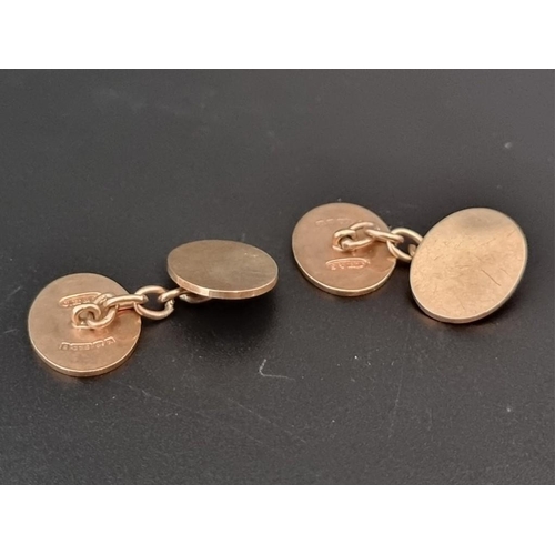 473 - A pair of 9ct gold oval cufflinks, with chain connectors, 10.8g