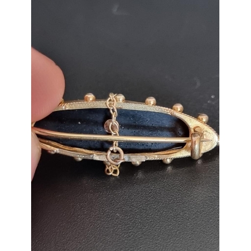 476 - A Victorian yellow metal black onyx and seed pearl memorial brooch, stamped 15ct, 15mm.... 