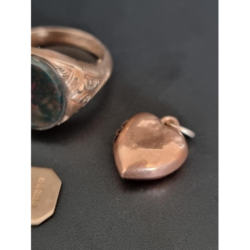 478 - A 9ct gold filled bloodstone signet ring, size R; together with a 9ct gold heart shaped pendant; and... 