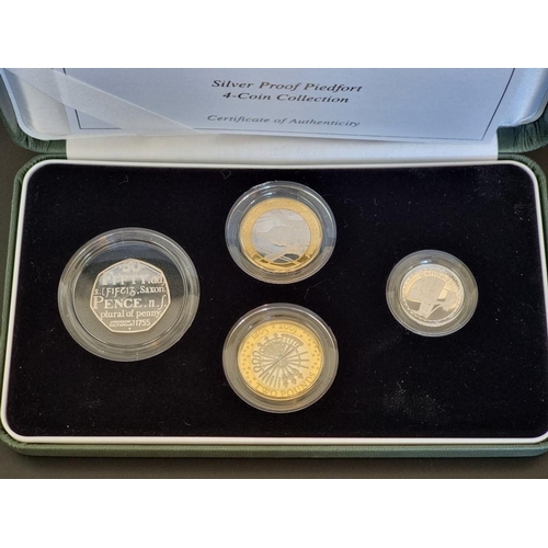 48 - Coins: a 2005 Royal Mint 'Silver Proof Piedfort Four Coin Collection', containing four coins, 50p to... 