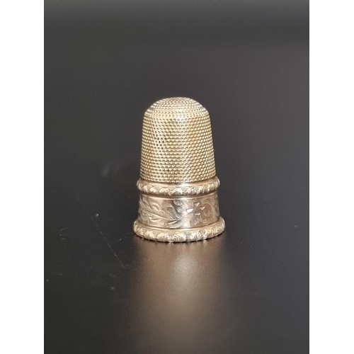 493 - A yellow metal thimble, 2.5cm high.