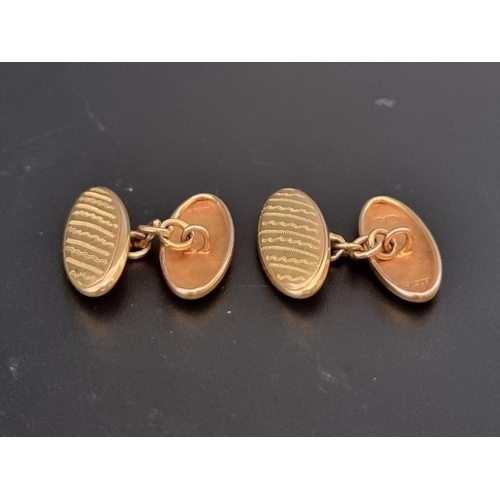 501 - A pair of 9ct gold cufflinks, with chain link connectors, 3.3g.