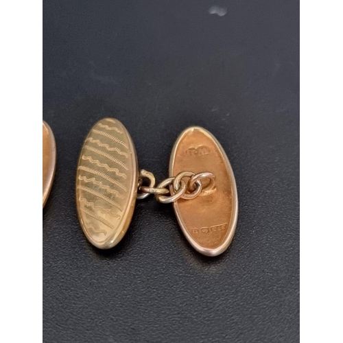 501 - A pair of 9ct gold cufflinks, with chain link connectors, 3.3g.