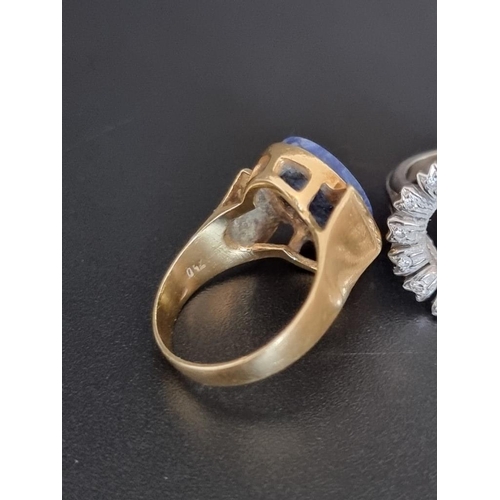 504 - Two yellow metal rings, set lapis lazuli and Sapphires and diamonds, each stamped 750; together with... 