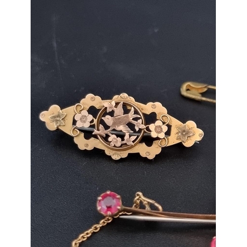 510 - A 9ct gold brooch, set central ruby surrounded by eight cabochon opals, 4.3cm, gross weight 4.8g; to... 