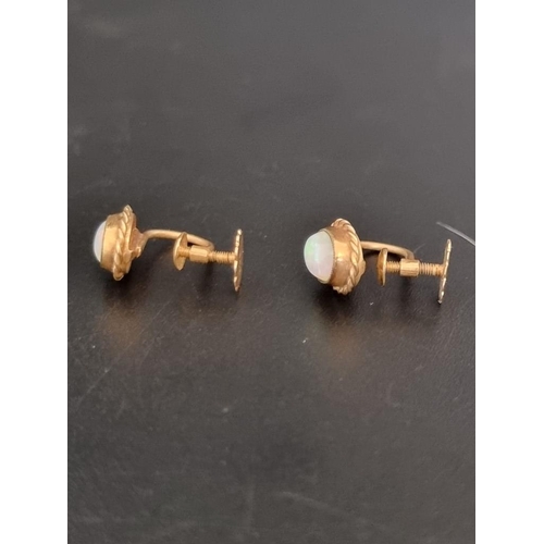 512 - A pair of yellow metal and opal screw back earrings, stamped 9ct.