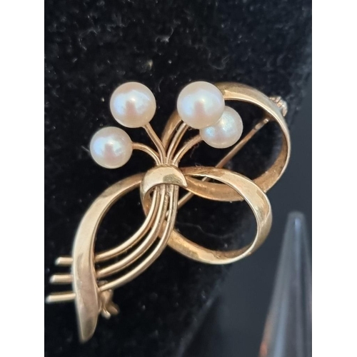 514 - A floral spray bar brooch set four pearls, stamped 14k, 42mm; together with a ring, with seven attac... 