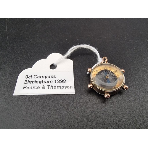 517 - A 9ct gold novelty 'ships wheel' compass charm, by Pearce & Thompson, Birmingham 1898, 21mm diam... 