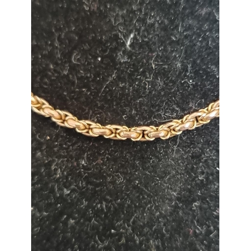 522 - A yellow metal belcher chain, stamped 9c, 41cm.