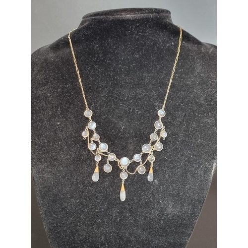 527 - A vintage yellow metal moonstone fringe necklace, 41cm.