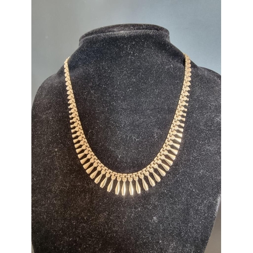 529 - A 9ct gold fringe necklace, 41cm, 14.5g.