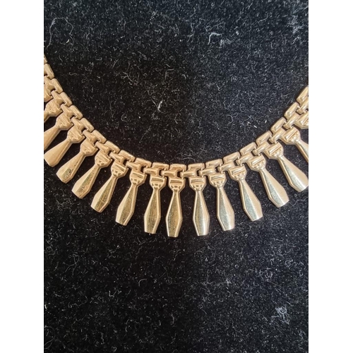 529 - A 9ct gold fringe necklace, 41cm, 14.5g.