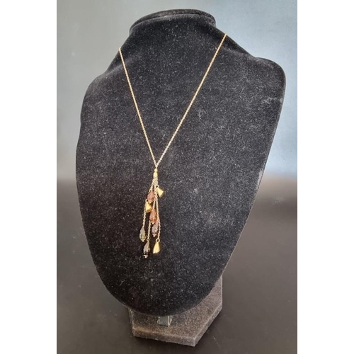 531 - A 9ct gold necklace, having eight gold and semi precious gem pendant drops, 42cm, gross weight 8.5g.... 